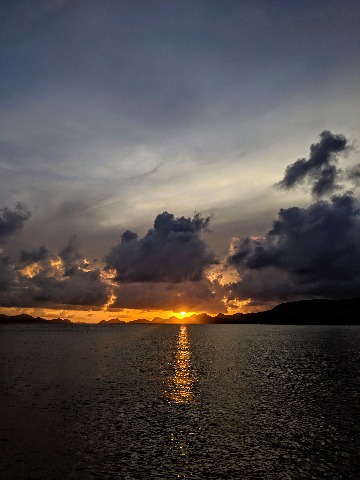 Carefree clients sunset view, as seen from Cooper Island, BVI